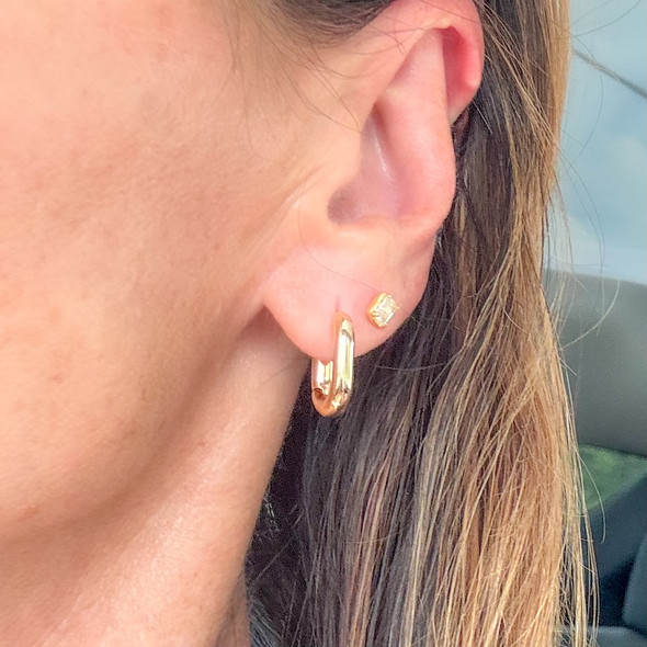 wearing rectangle gold hoops