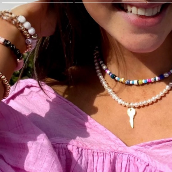 wearing rainbow choker and pearl key necklace layered