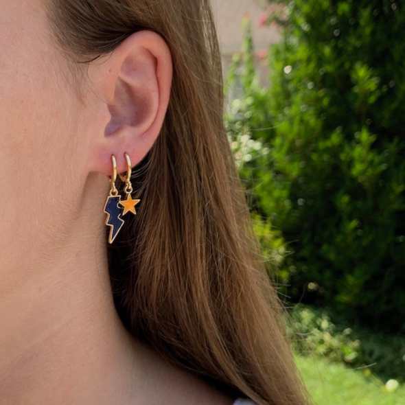wearing blue and orange earring stack for UVA, Auburn