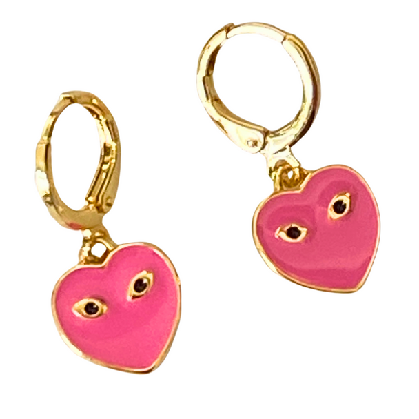 Close up of Barbie Pink Mini Eye Heart You Huggie Hoops Background Removed