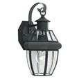 Outdoor Lights By Thomas One-light traditional outdoor wall lantern with clear glass panels and rounded molding in a Brushed SL941378