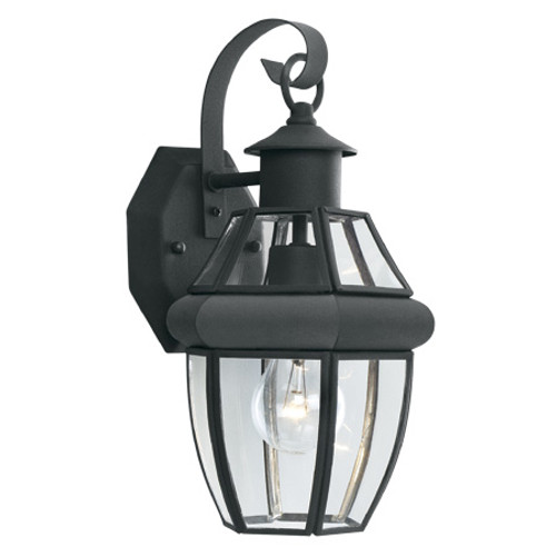 Outdoor Lights By Thomas One-light traditional outdoor wall lantern with clear glass panels and rounded molding in a Painted SL941363