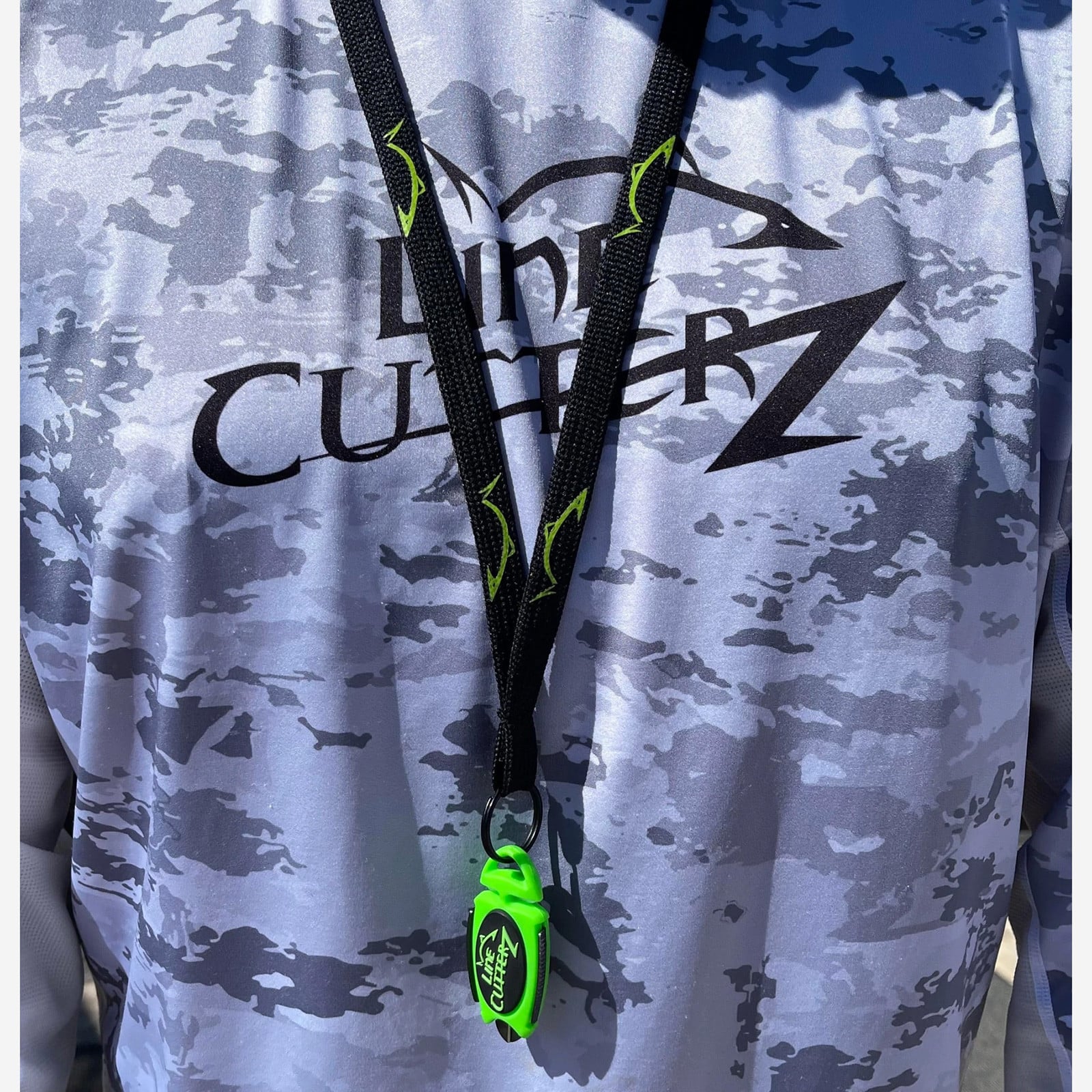 Line Cutterz Dual Hybrid Micro Scissors attached on a lanyard