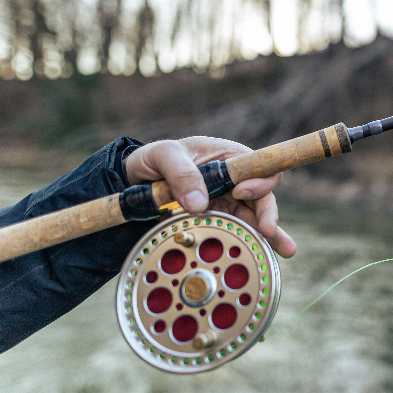 Closeup of cork grip with slip rings holding a reel (not included) on Temple Fork Outfitters Steeldriver Centerpin Rod