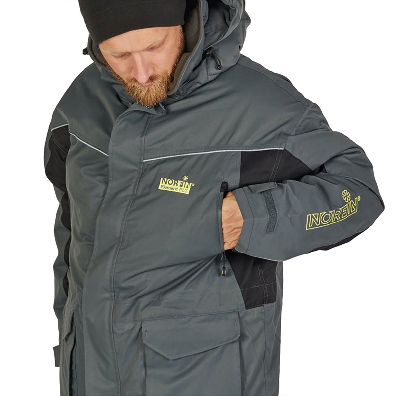 Norfin Element Float Suit jacket with model tucking hand in upper left chest pocket