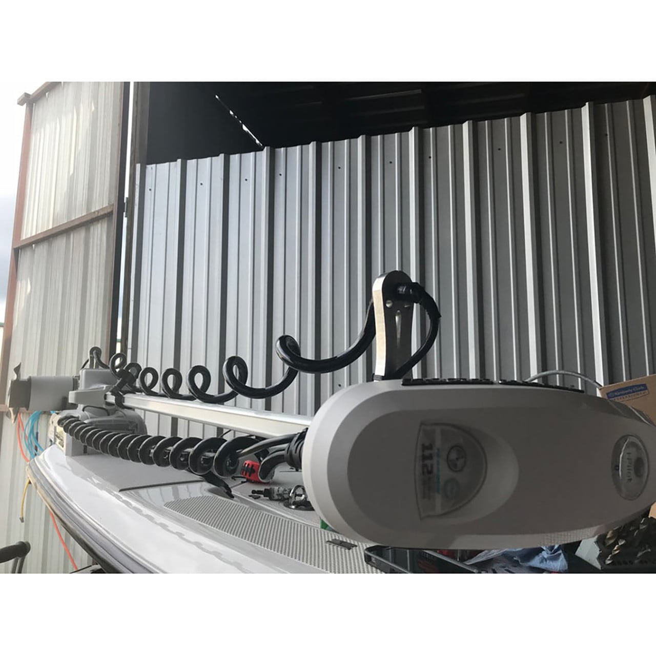 Precision Sonar Cable Guard showing one aluminum bracket and coiled hose on transducer