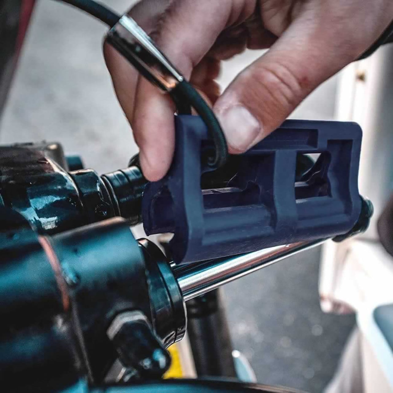 T-H Marine Steer Stop Outboard Hydraulic Steering Lock partially attached to steering ram