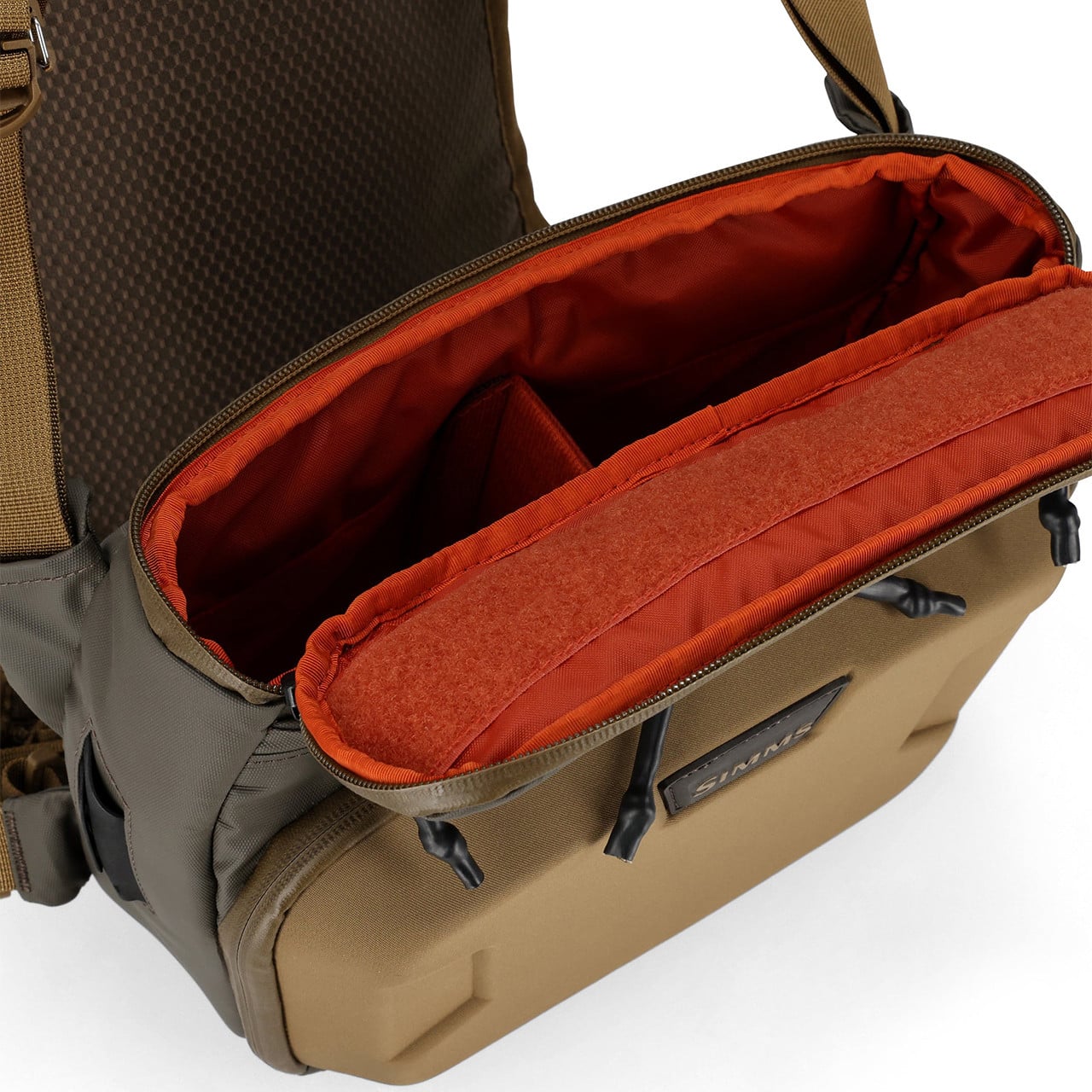 Simms Headwaters Chest Pack inside includes a main compartment with an internal divider and a compression-molded workstation with a fly patch