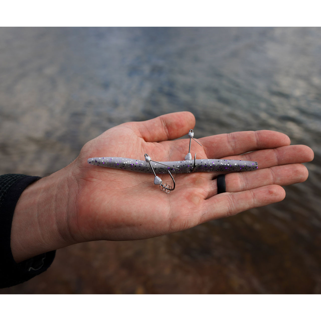 Core Tackle Weedless Wacky Shot pair in palm of hand, one rigged with soft plastic worm