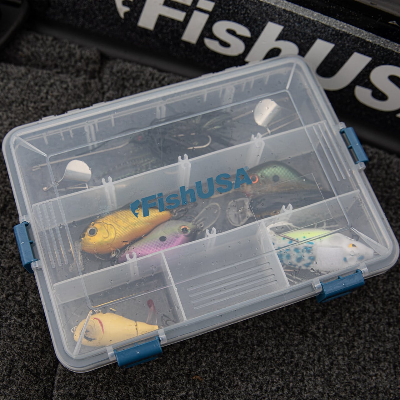FishUSA Flagship Small Waterproof Tackle Box closed in use (baits pictured not included)