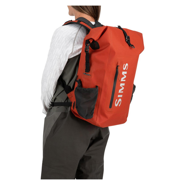 Simms Dry Creek Rolltop Backpack color Simms Orange wearing side