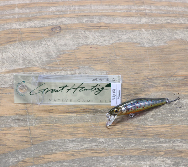 Megabass Great Hunting GH Heavy Duty Crankbait Takumi Iwana color with Megabass Packaging on Wood Table