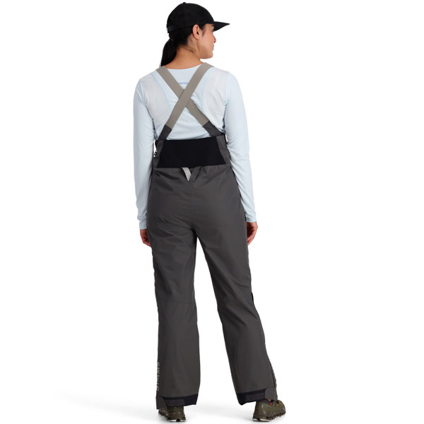 Simms Women's Challenger Fishing Bib rain gear in color Slate back view on model