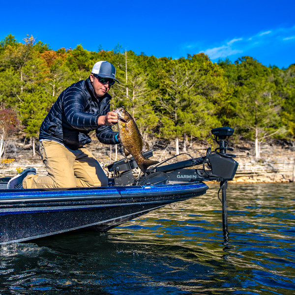 Garmin Force Trolling Motor on boat with an angler lifting a smallmouth bass