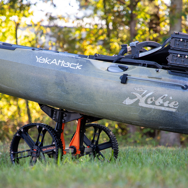 Large kayak supported by a YakAttack Tow-N-Stow Scupper Cart
