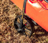 YakAttack TowNStow Bar Cart Kayak Cart with kayak close up of cam strap inserted into integrated wheel loop