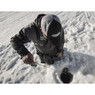 St. Croix Custom Ice Rod man fishing with rod and ice hole