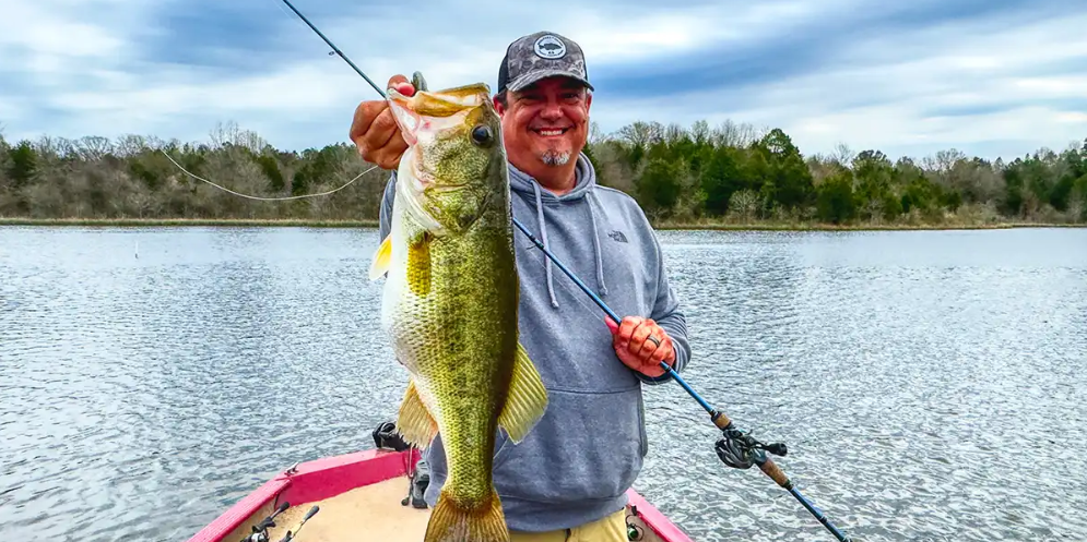 Wired2Fish's Jason Sealock with a largemouth bass caught on Flagship Bass Casting Rod