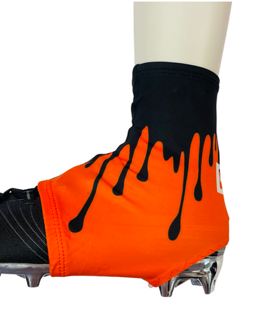 orange and black football cleats