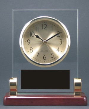 Clock rectangle with posts rosewood piano finish 5-3/4 wide by 6-1/2 inches tall.