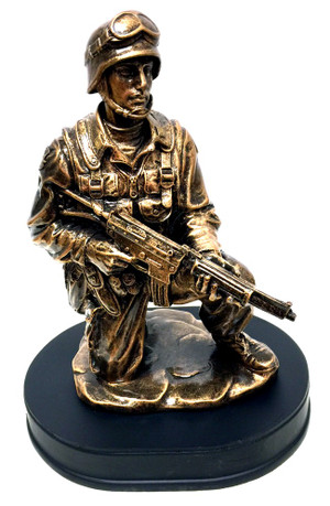 10" tall bronzetone Soldier kneeling holding rifle military statue mounted on black base.