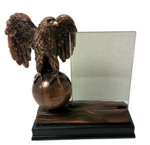 A stunning retirement gift, this bronze tone eagle on top of the world is 8-1/2 inches high and has a 4-1/2 inches wingspan. It comes with a 4 inches by 6 inches optical glass plate that can be engraved for free with up to 120 characters.