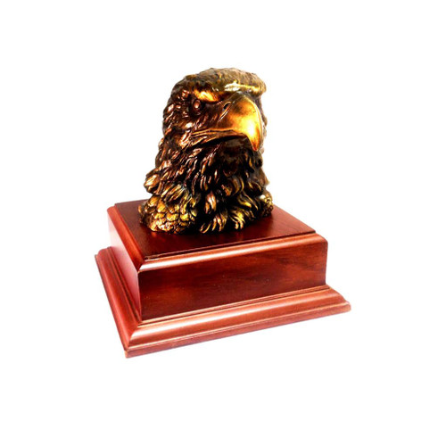 Eagle head retirement gift idea mounted on a 5-1/5 inches long by 5-1/2 inches wide by 2.0 inches high laminated cherry base with free engraving.