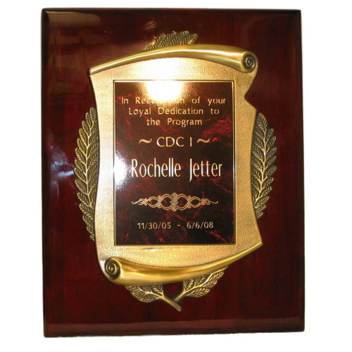 This beautifully crafted retirement plaque features a metal scroll mounted on a solid wood board with a rich piano rosewood finish. Measuring 15 inches high by 12 inches wide, it includes an engraving area on the scroll that’s 7 inches wide and 10 inches high.