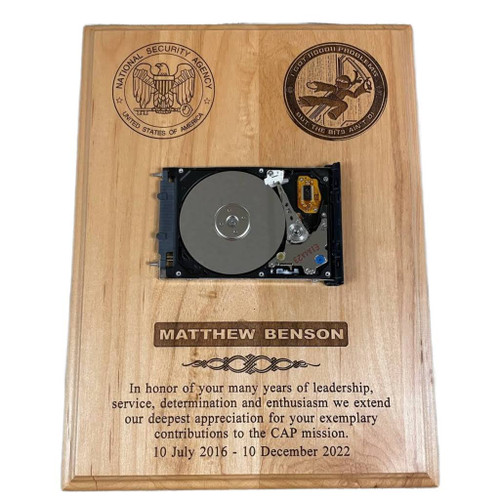 CCI laser engraved genuine red alder wood recognition plaque 9 inches x 12 inches.  Hard drive is not included. We can mount a hard drive or any other object at no additional cost.
