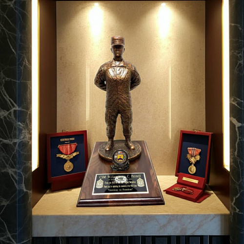 A military statue of a female warrior in patrol cap standing at parade rest, 17 inches tall, on a genuine walnut base of 9 by 12 inches with a holder for a challenge coin. No challenge coin is provided: a medallion of Army, Air Force, Navy or Marine will be included unless otherwise specified.