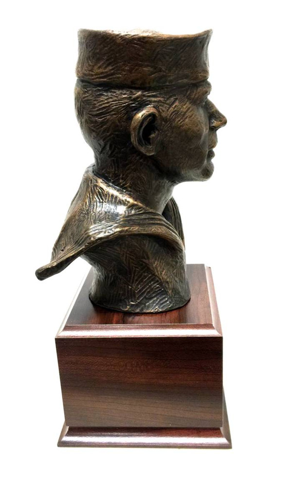 The statue is a 12-inch-high bust of a Sailor, mounted on a laminated cherry base that is 5.5 inches wide, long, and 4 inches tall. Free engraving is included with the statue.