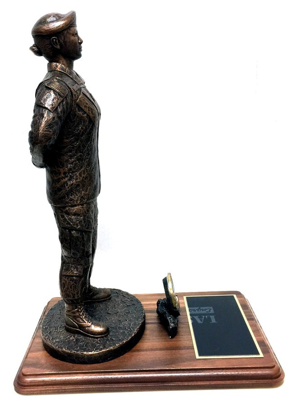 17" tall military female at parade rest military statue mounted on a 9" x 12" genuine walnut base with challenge coin holder.  Challenge coin not included: Army, Air Force, Navy or Marine medallion will be sent instead unless requested otherwise.