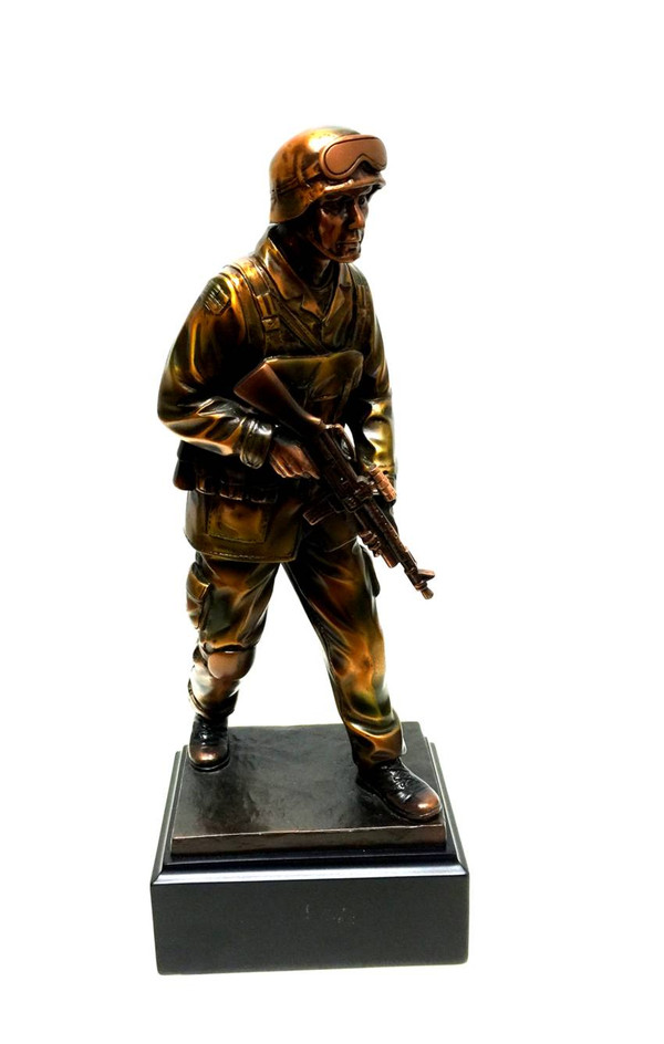 A bronze tone Soldier military statue with high detail stands 11.5 inches tall on a black base.