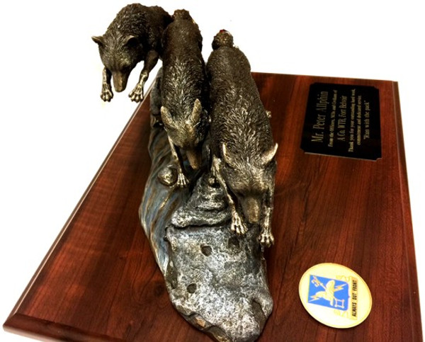 Awesome Wolfpack statue mounted on a 15 inches x 12 inches laminated walnut base.  The coin on the left can be Army, Air Force, Navy, Marine or Coast Guard. (Please Specify)