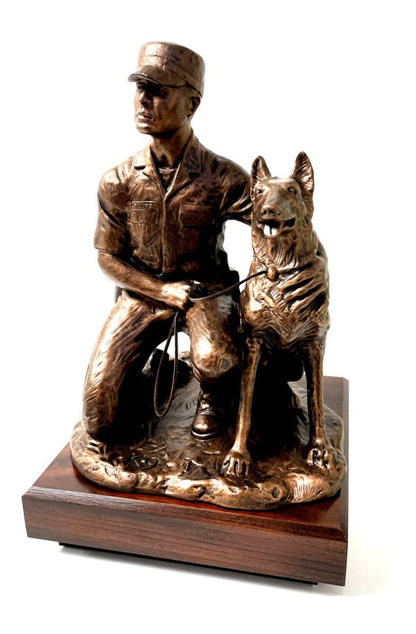 U.S. Army Dog Handler Male Military Statue K9, 12" tall mounted on 6 inches long by 6 inches wide by 2 inches tall, laminated cherry base.  Engraving plate is 5" wide x 1" high, with free engraving.