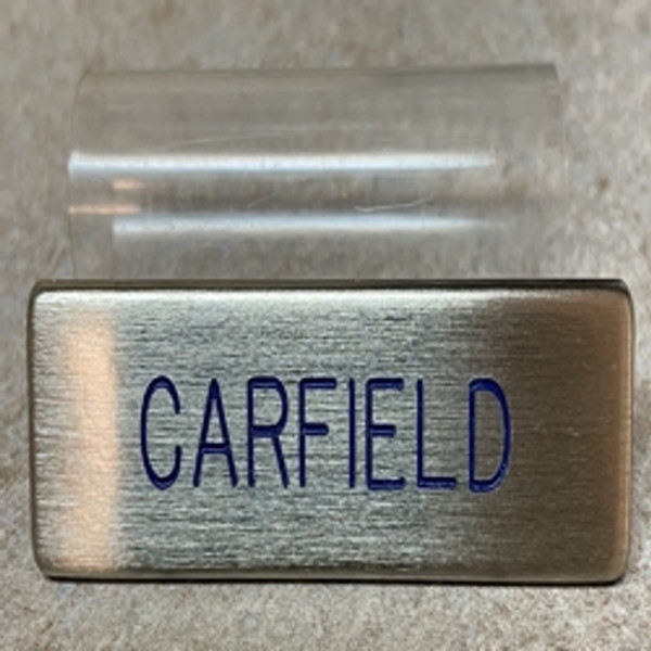 U.S. Air Force dress regulation military name badge metal, silver with blue letters with plastic enclosure. 3 inches long by 3/4 inch high. Call if expedited service is required. Ships within 48 hours when ordered by 12 Noon Eastern Time.