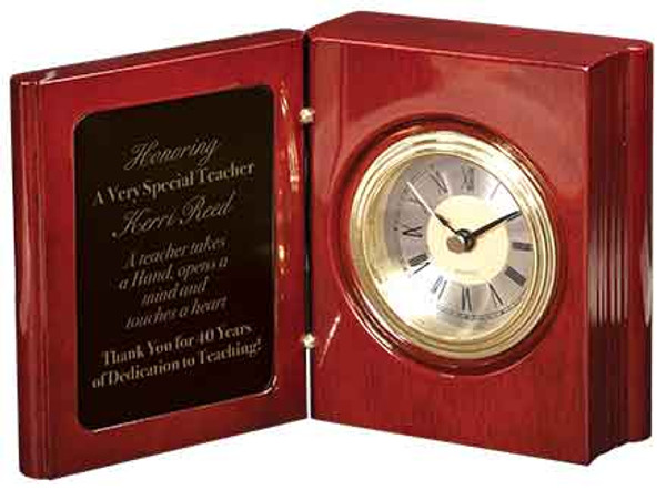 Folding book clock rosewood piano finish. Very elegant hinged award. 4 inches wide by 5-1/2 inches high by 2 inches deep.
