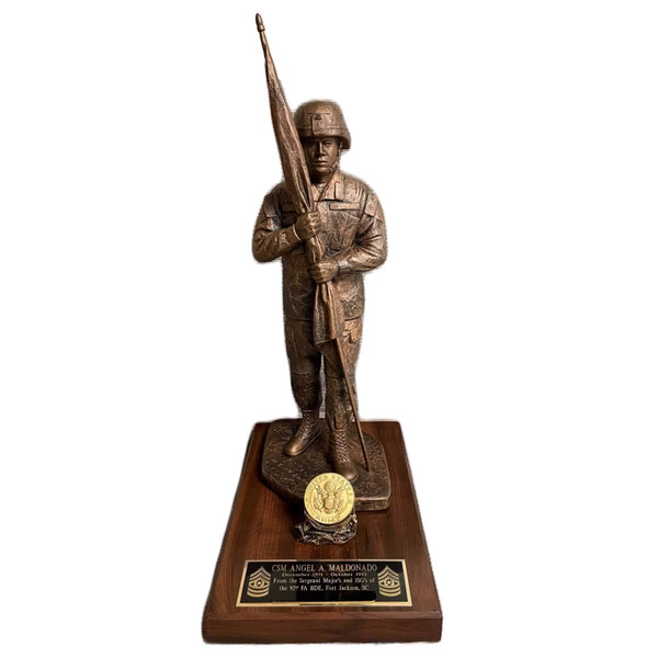 14" tall CSM military statue "Keeper of the Colors" with Kevlar Helmet, mounted on 12 inches long by 8 inches wide by 1-1/4 inches high, laminated cherry base with coin holder.