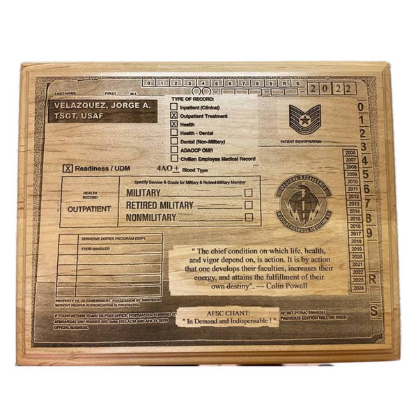 This is an 8" by 10" Alder solid wood plaque engraved with a USAF Medical Record as a novelty item. It is not intended to represent an official medical record. Please provide your Rank or Title, Last Four of SSAN, Blood Type, Assignment Dates and Narrative if applicable. This work is created by Mai's Engraving and is protected by intellectual property rights.