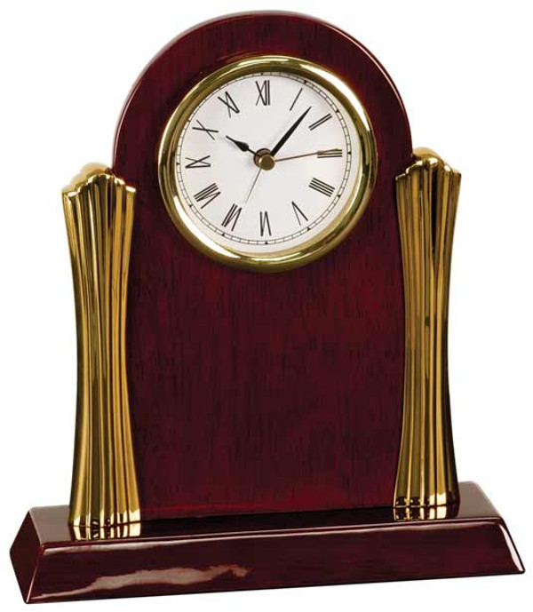 Clock desk rosewood piano finish with gold metal columns 8-1/4 inches high by 7-1/2 inches wide, battery is included, with free engraving.