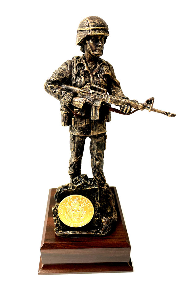 A military statue of a female soldier, 11 inches tall, stands on a laminated cherry base that measures 5.5 inches by 5.5 inches by 2 inches. The statue has a total height of 13 inches. The base has an Army medallion that can be replaced if needed.