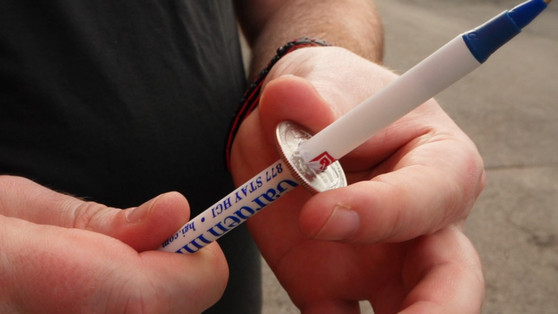 Pen Through Coin by Michael Ammar