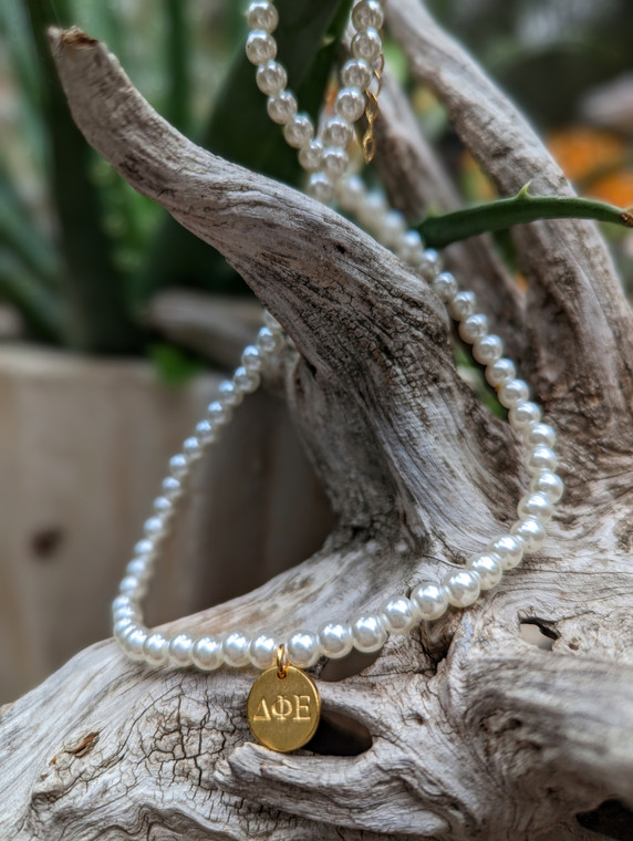 Beautifully hand crafted pearl inspired necklace, expandable to 16"-18" with lobster claw  - wear as choker or to desired necklace length. 

Greek charm is 22k gold plating and measures 1/2" in diameter.

This necklace is light weight and timeless for everyday wear.