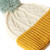 Child's Merino Knitted Hat With Pompom Yellow/White
