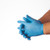 Two hands wearing nitrile gloves