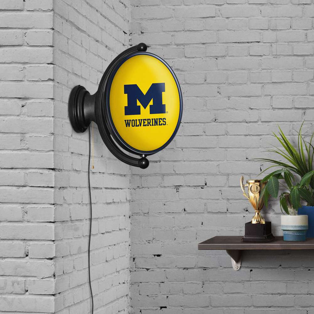 Michigan Wolverines Original Oval Rotating Lighted Wall Sign - Maize