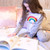 child wearing personalised rainbow pyjamas