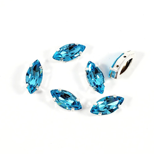 Crystal Navette Dk Aqua 7x15mm w/silver claw setting.