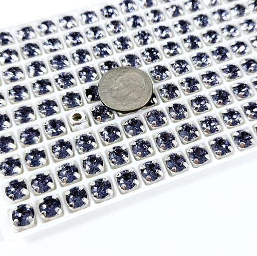 6mm chaton stone in silver claw setting. Tanzanite. 6mm chaton stone in silver claw setting. Tanzanite.