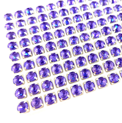 6mm chaton stone in silver claw setting. Violet Ultra AB. 6mm chaton stone in silver claw setting. Violet Ultra AB.